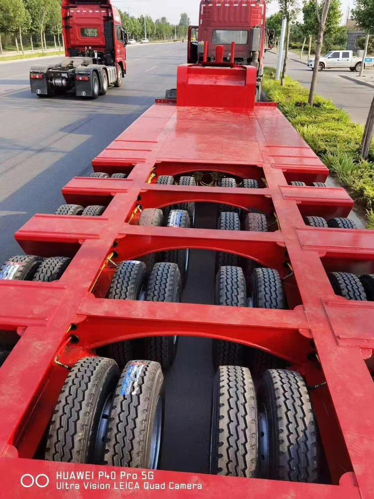 多轴线特种车24个轮胎半挂车 液压爬梯低平板车型制造厂家